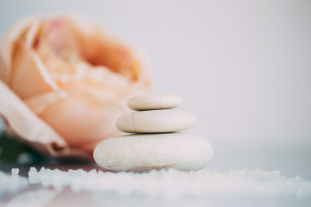 Spa still life with stacked of stone. Holiday, body care and luxury concept.